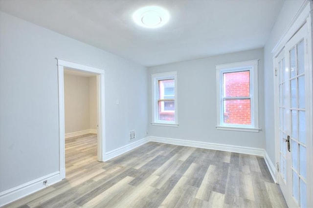 5027 S Broadway Ave Unit 1-4, Saint Louis, MO 63111 - unfurnished bedroom with light wood-style floors and baseboards