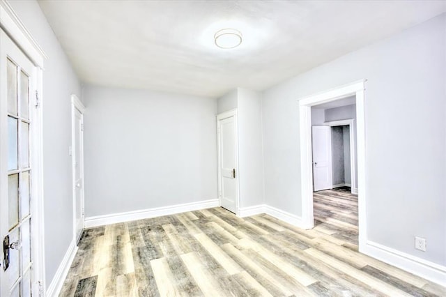 5027 S Broadway Ave Unit 1-4, Saint Louis, MO 63111 - unfurnished bedroom featuring wood finished floors and baseboards