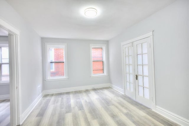 5027 S Broadway Ave Unit 1-4, Saint Louis, MO 63111 - empty room with light wood-type flooring and baseboards