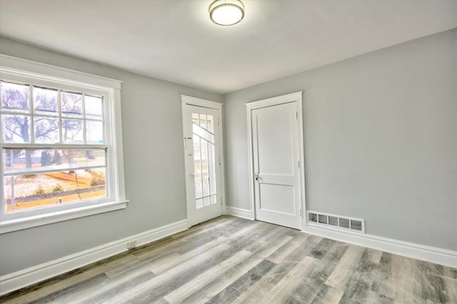 5027 S Broadway Ave Unit 1-4, Saint Louis, MO 63111 - unfurnished room featuring baseboards and wood finished floors
