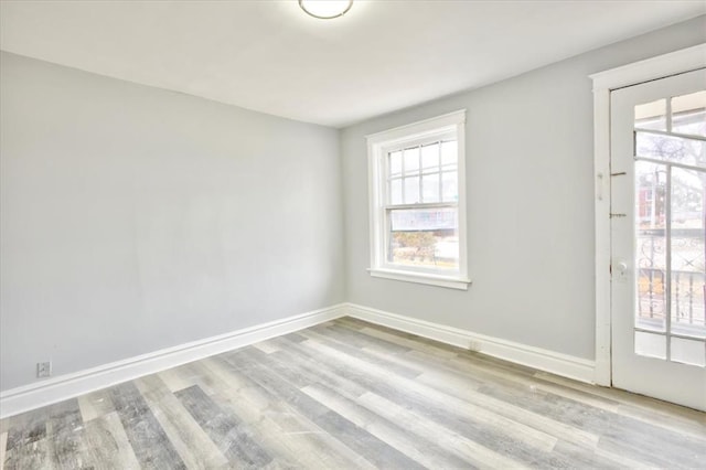 5027 S Broadway Ave Unit 1-4, Saint Louis, MO 63111 - empty room with wood finished floors, healthy amount of natural light, and baseboards