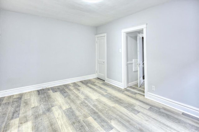 5027 S Broadway Ave Unit 1-4, Saint Louis, MO 63111 - unfurnished room with wood finished floors and baseboards