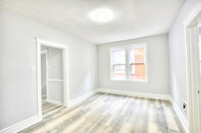 5027 S Broadway Ave Unit 1-4, Saint Louis, MO 63111 - spare room with wood finished floors and baseboards