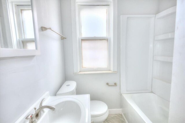 5027 S Broadway Ave Unit 1-4, Saint Louis, MO 63111 - full bathroom featuring plenty of natural light, toilet, and a sink
