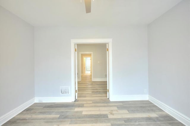 5027 S Broadway Ave Unit 1-4, Saint Louis, MO 63111 - unfurnished room with wood finished floors, baseboards, and ceiling fan