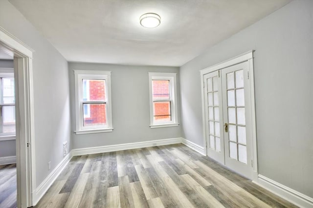 5027 S Broadway Ave Unit 1-4, Saint Louis, MO 63111 - unfurnished room with wood finished floors and baseboards