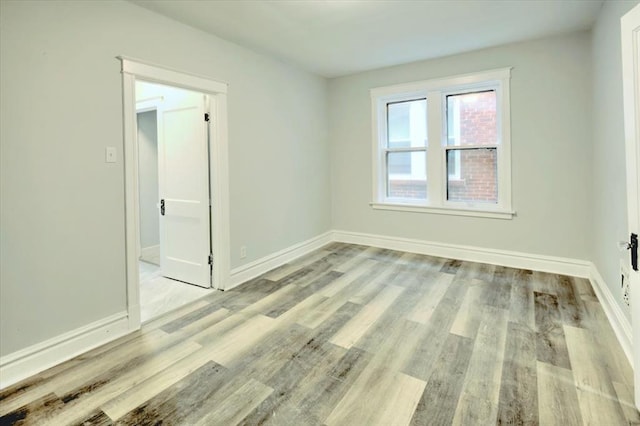 5027 S Broadway Ave Unit 1-4, Saint Louis, MO 63111 - empty room featuring wood finished floors and baseboards