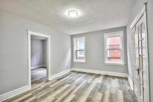 5027 S Broadway Ave Unit 1-4, Saint Louis, MO 63111 - unfurnished room with baseboards and wood finished floors