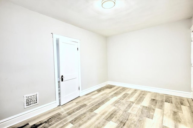 5027 S Broadway Ave Unit 1-4, Saint Louis, MO 63111 - spare room featuring wood finished floors and baseboards