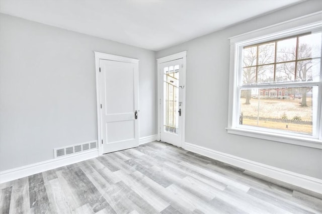 5027 S Broadway Ave Unit 1-4, Saint Louis, MO 63111 - spare room featuring wood finished floors, baseboards, and healthy amount of natural light