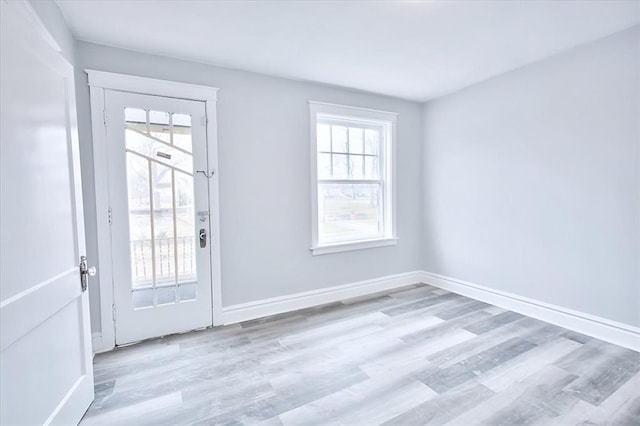 5027 S Broadway Ave Unit 1-4, Saint Louis, MO 63111 - doorway to outside with wood finished floors and baseboards
