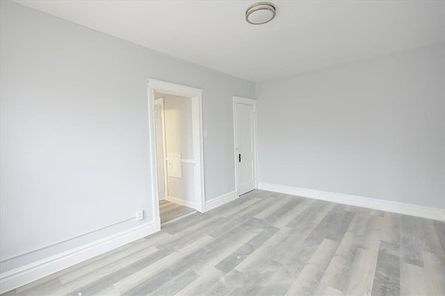 5027 S Broadway Ave Unit 1-4, Saint Louis, MO 63111 - empty room featuring light wood-type flooring and baseboards