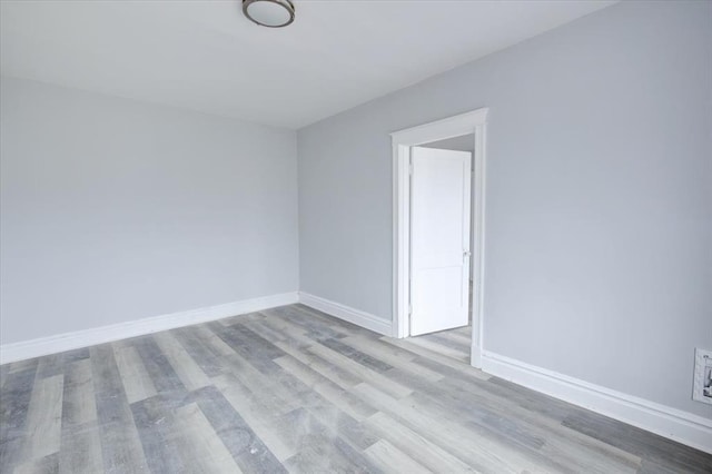 5027 S Broadway Ave Unit 1-4, Saint Louis, MO 63111 - unfurnished room with wood finished floors and baseboards