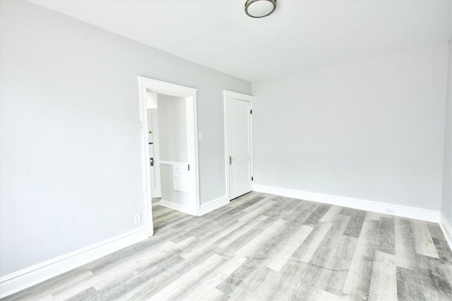 5027 S Broadway Ave Unit 1-4, Saint Louis, MO 63111 - spare room featuring wood finished floors and baseboards