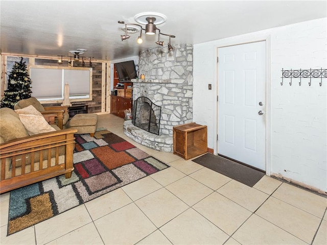 584 Watch Hill Rd, Collinsville, IL 62234 - tiled living room featuring a stone fireplace