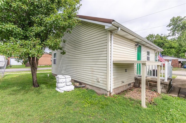 700 E S Main St, Dexter, MO 63841 - view of home's exterior with a yard and crawl space