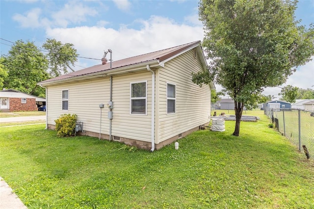 700 E S Main St, Dexter, MO 63841 - view of property exterior with metal roof and crawl space