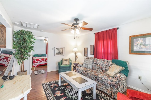 700 E S Main St, Dexter, MO 63841 - living area with ceiling fan, baseboards, and wood finished floors