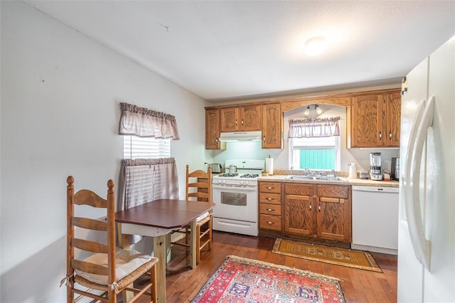 700 E S Main St, Dexter, MO 63841 - kitchen featuring white appliances, a sink, under cabinet range hood, and brown cabinets