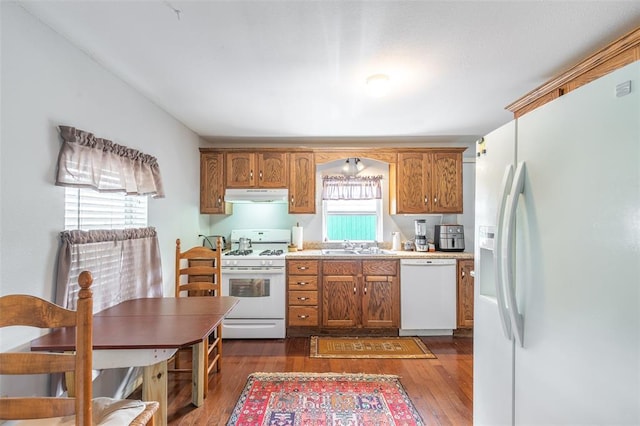 700 E S Main St, Dexter, MO 63841 - kitchen featuring white appliances, extractor fan, brown cabinetry, and dark wood-style floors