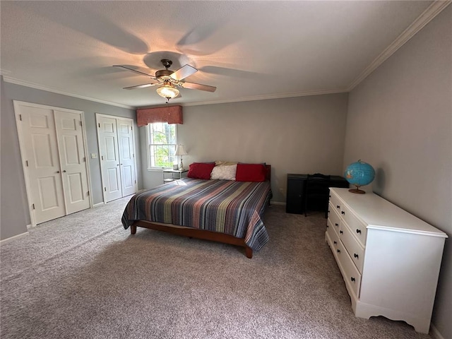 16 Siesta Dr, Hannibal, MO 63401 - carpeted bedroom featuring two closets, ornamental molding, a ceiling fan, and baseboards