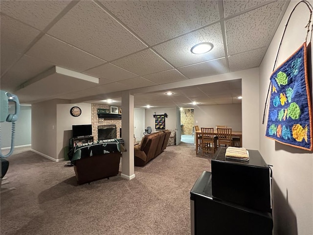 16 Siesta Dr, Hannibal, MO 63401 - carpeted living room with a drop ceiling, a fireplace, and baseboards