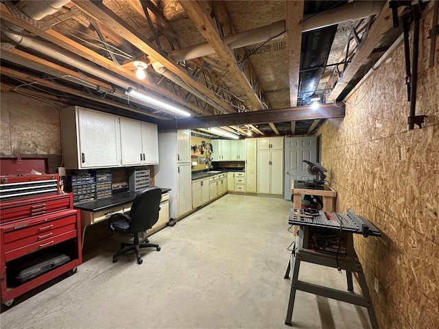 16 Siesta Dr, Hannibal, MO 63401 - home office featuring unfinished concrete flooring and a workshop area