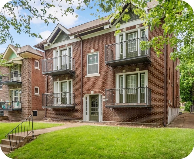 4932 Mardel, Saint Louis, MO 63109 - view of front facade with brick siding, a balcony, and a front lawn