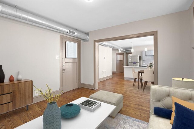 4932 Mardel, Saint Louis, MO 63109 - living room featuring light wood-type flooring and baseboards