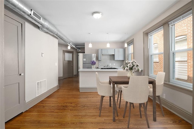 4932 Mardel, Saint Louis, MO 63109 - dining area featuring light wood-style floors and baseboards