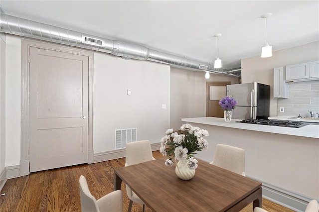 4932 Mardel, Saint Louis, MO 63109 - dining area featuring baseboards and wood finished floors