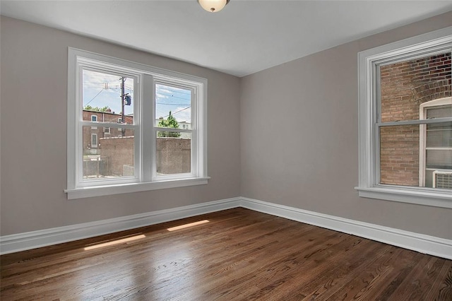 4932 Mardel, Saint Louis, MO 63109 - empty room featuring baseboards and dark wood-type flooring