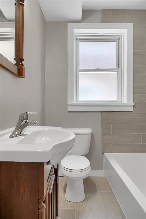 4932 Mardel, Saint Louis, MO 63109 - bathroom with a tub, toilet, tile patterned floors, baseboards, and vanity