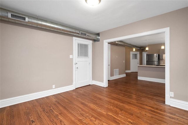 4932 Mardel, Saint Louis, MO 63109 - unfurnished living room featuring wood finished floors and baseboards