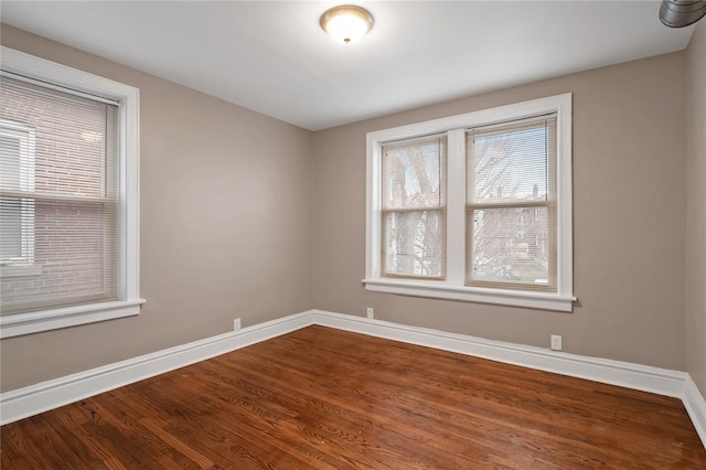 4932 Mardel, Saint Louis, MO 63109 - unfurnished room with baseboards and dark wood-style flooring