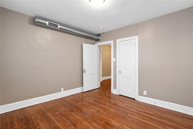 4932 Mardel, Saint Louis, MO 63109 - unfurnished bedroom with baseboards and wood finished floors