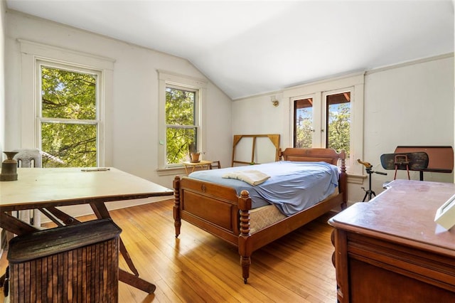 7511 Milan Ave, University City, MO 63130 - bedroom featuring lofted ceiling and light wood finished floors
