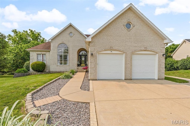 113 Riverwalk Dr, Desloge, MO 63628 - view of front of home with brick siding, a front yard, driveway, and an attached garage