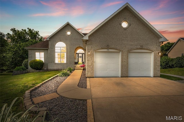 113 Riverwalk Dr, Desloge, MO 63628 - view of front of house featuring driveway, a lawn, brick siding, and a garage