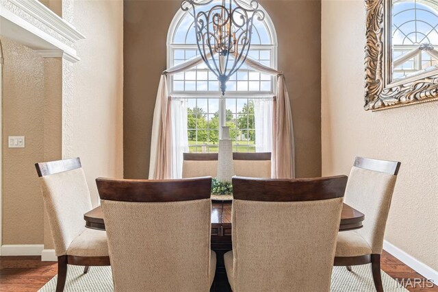 113 Riverwalk Dr, Desloge, MO 63628 - dining space featuring a textured wall, baseboards, wood finished floors, and a chandelier