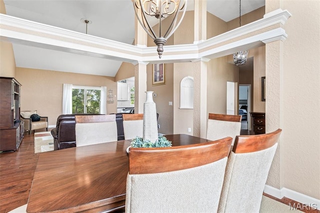 113 Riverwalk Dr, Desloge, MO 63628 - dining room featuring a chandelier, decorative columns, a textured wall, baseboards, and vaulted ceiling