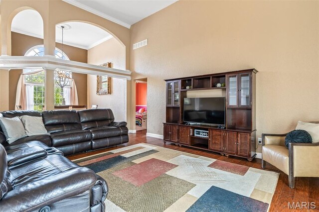 113 Riverwalk Dr, Desloge, MO 63628 - living area with dark wood-style floors, crown molding, and baseboards