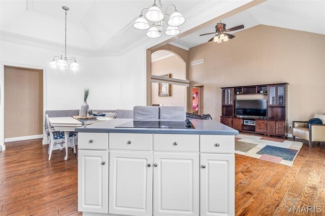 113 Riverwalk Dr, Desloge, MO 63628 - kitchen featuring vaulted ceiling, open floor plan, a chandelier, light wood-style floors, and crown molding