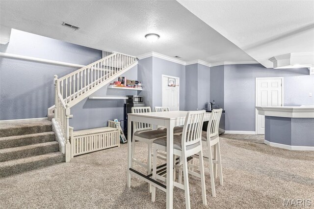 113 Riverwalk Dr, Desloge, MO 63628 - carpeted dining room with stairway, crown molding, a textured ceiling, and baseboards