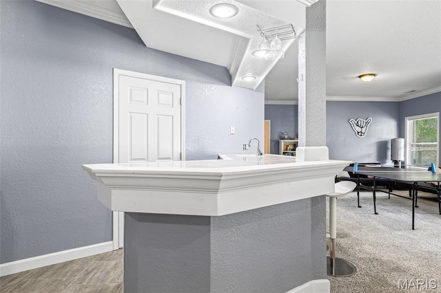 113 Riverwalk Dr, Desloge, MO 63628 - bar area with a textured wall, ornamental molding, baseboards, and a sink