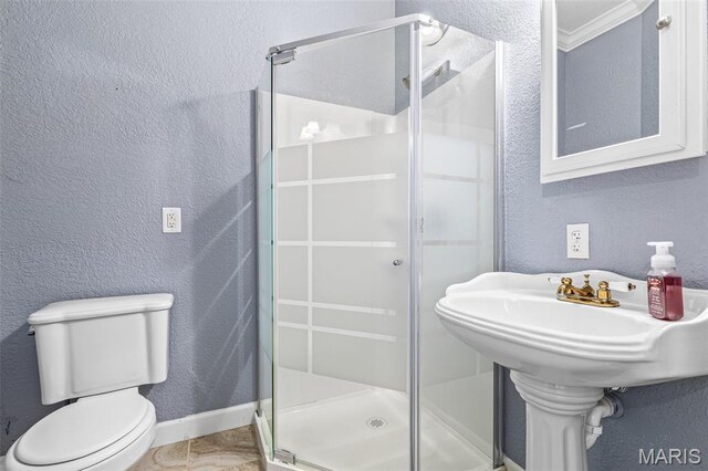 113 Riverwalk Dr, Desloge, MO 63628 - bathroom featuring a stall shower, toilet, a textured wall, baseboards, and tile patterned flooring