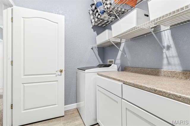 113 Riverwalk Dr, Desloge, MO 63628 - laundry area featuring a textured wall, washer and dryer, and baseboards
