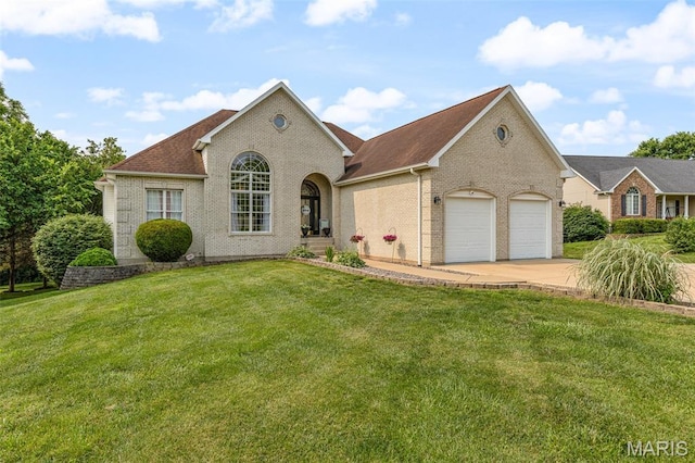 113 Riverwalk Dr, Desloge, MO 63628 - view of front of property with brick siding, a garage, concrete driveway, a front yard, and roof with shingles
