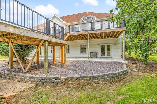 113 Riverwalk Dr, Desloge, MO 63628 - back of property featuring a wooden deck, a shingled roof, a patio, and french doors