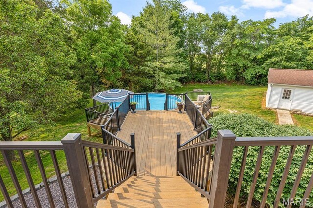 113 Riverwalk Dr, Desloge, MO 63628 - deck with stairs, an outdoor pool, a lawn, and an outbuilding
